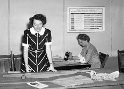 Vintage shot of woman at the cutting table.